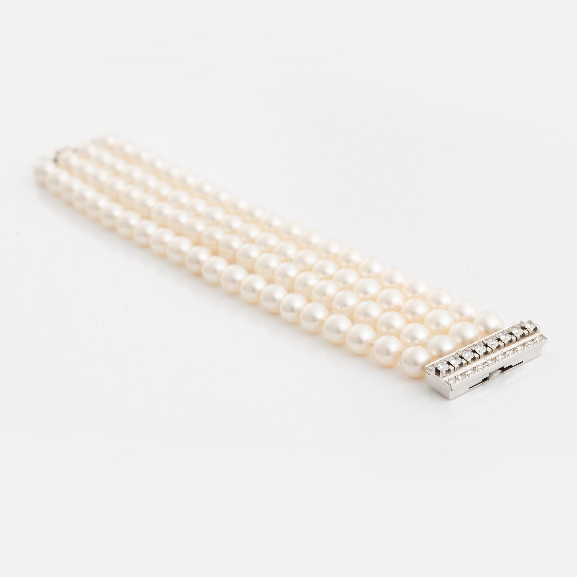 Four strand cultured pearl bracelet, clasp white gold with brilliant cut diamonds.