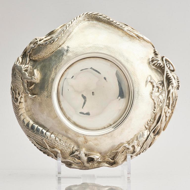 A Chinese double walled 'dragon' silver bowl, Shanghai, around 1900.