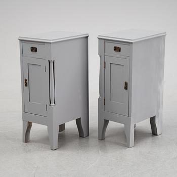 A pair of painted bedside tables stands. First half of the 20th century.