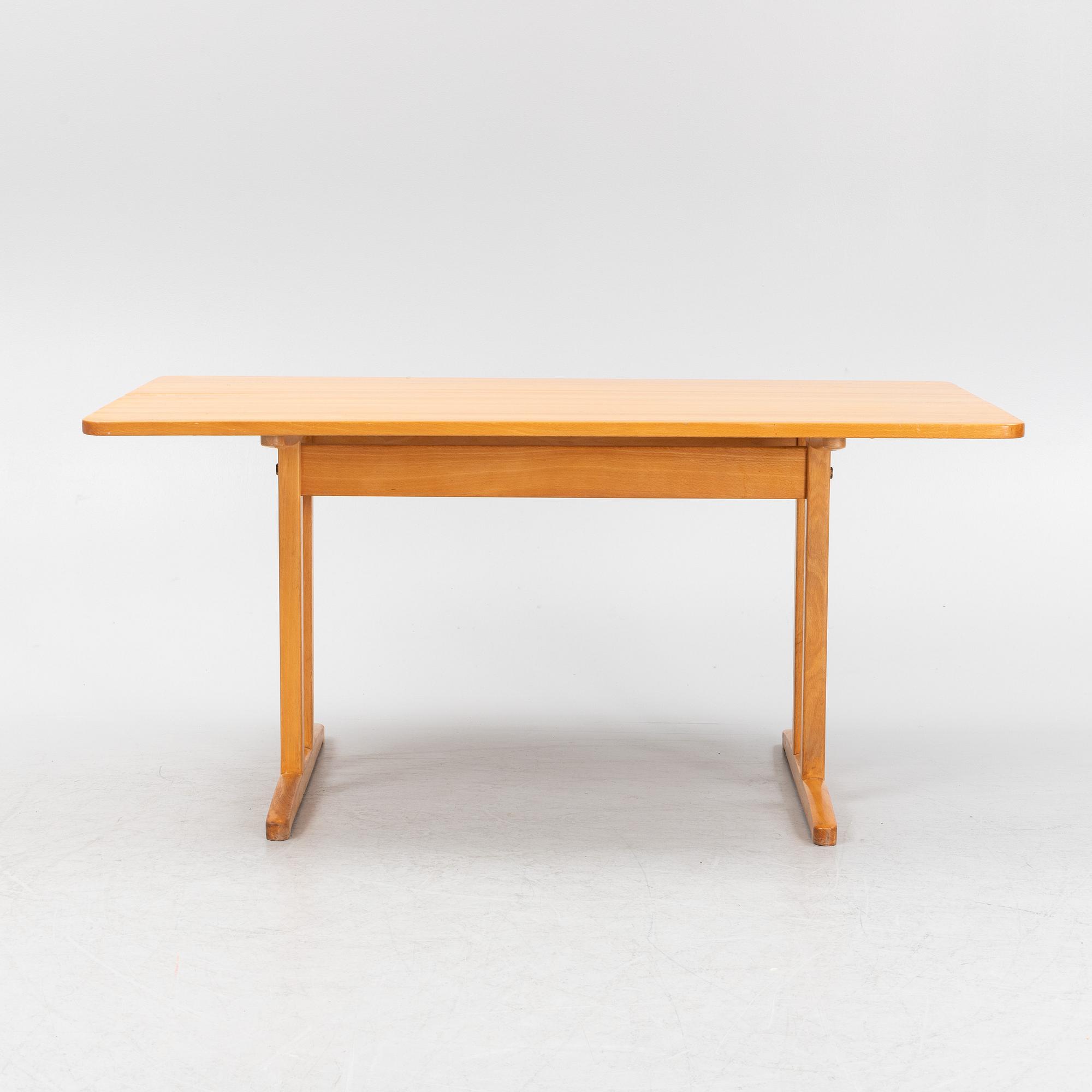 A beech dining table, second half of the 20th Century.