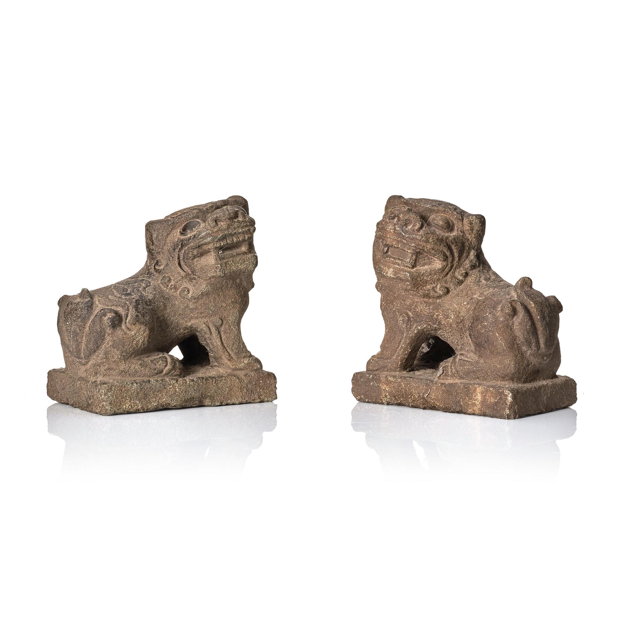 A pair of stone sculptures of buddhist lions, Qing dynasty (1664-1912).