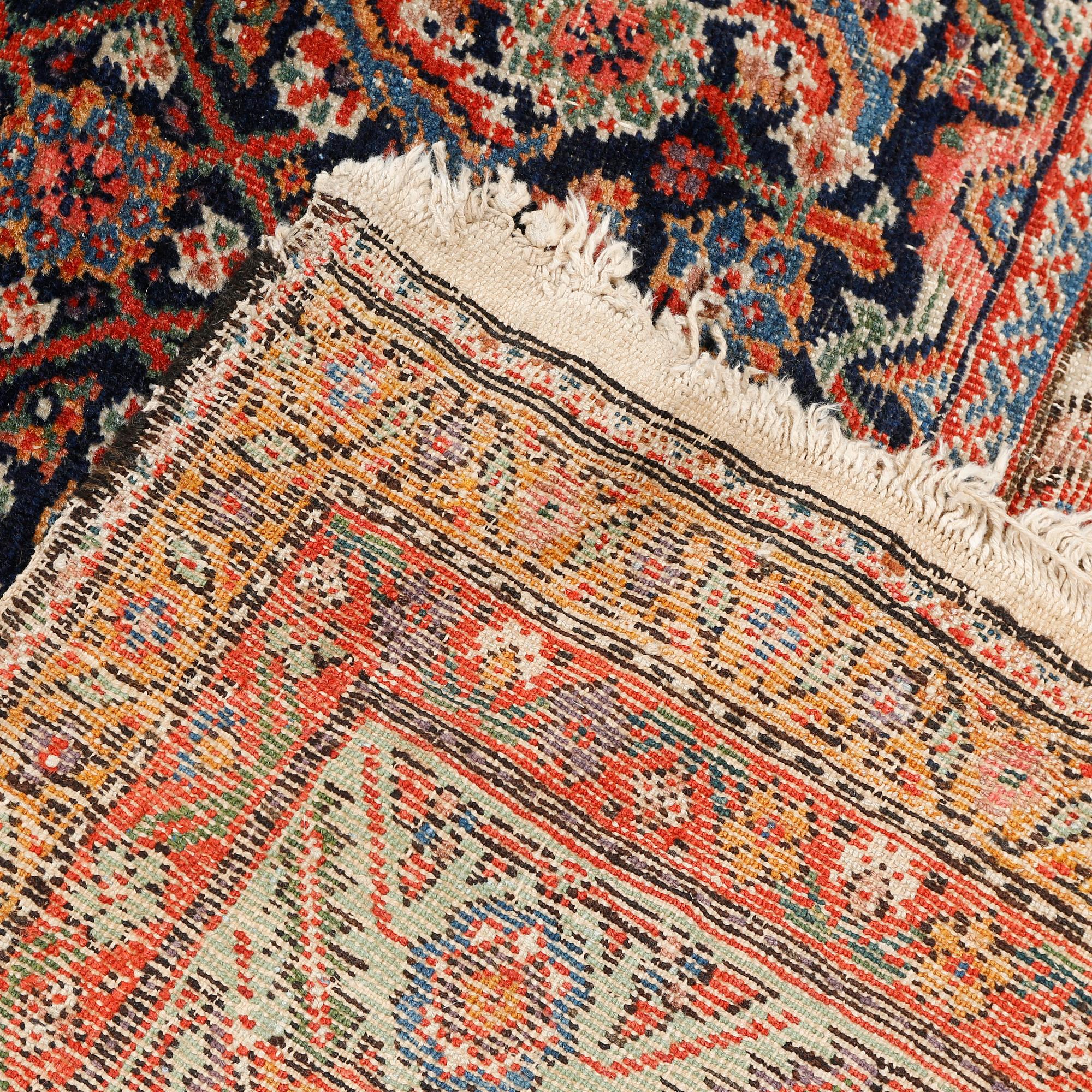 A Farahan rug, semi-antique/antique, 390 x 197 cm.