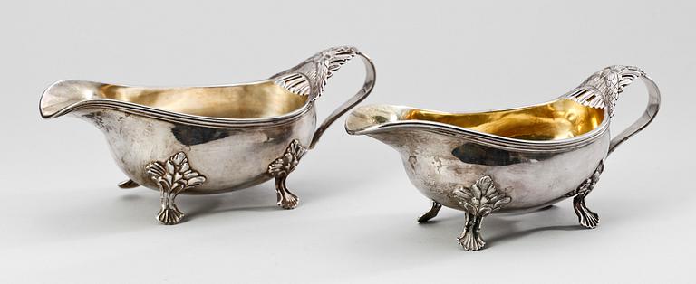 SÅSSNIPOR, ett par snarlika, silver, B.Erlandsson, Kristianstad 1911 resp John Pettersson eftr, Stockholm 1915. 534 gram.