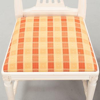 A dining table with eight chairs and a stool, Gustavian style, second half of the 20th Century.