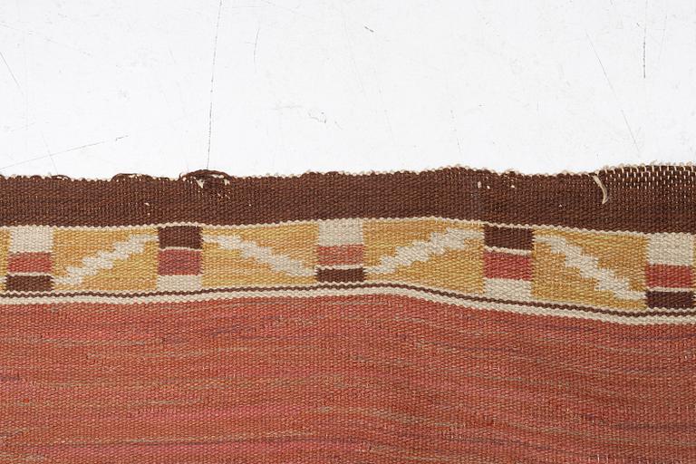 A flat weave carpet, c. 360 x 265 cm.