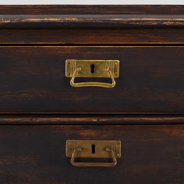 A chest of drawers, circa 1900.
