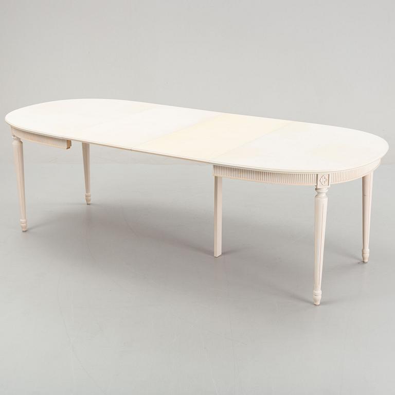 A dining table with eight chairs and a stool, Gustavian style, second half of the 20th Century.