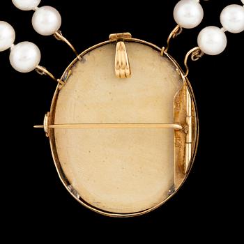 Lava cameo and cultured pearl necklace.