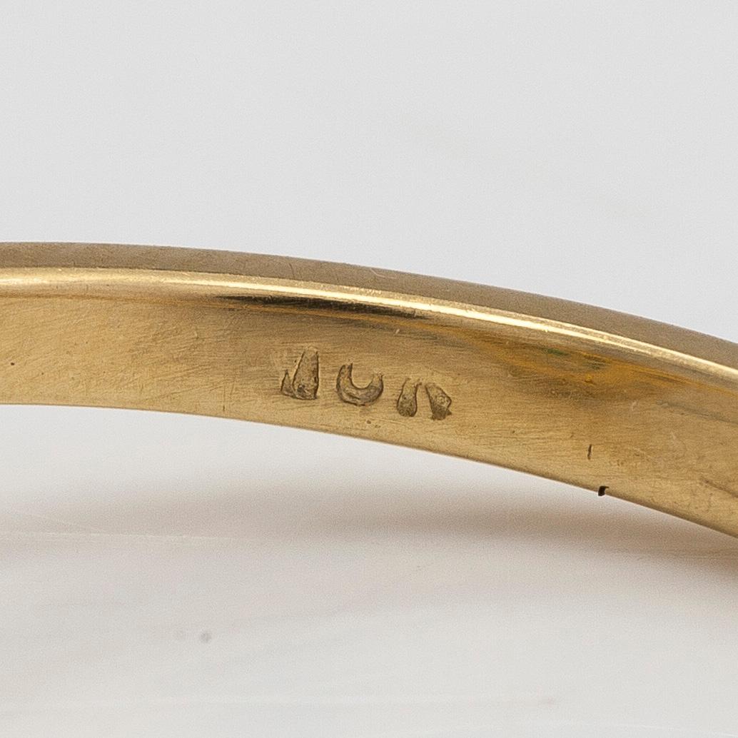 Sormus, 18K kultaa, smaragdi sekä briljanttihiottuja timantteja yht n 0.18 ct.