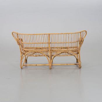 A mid 20th century ratten couch.