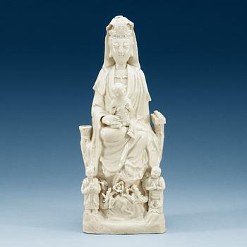 1433. A blanc de chine figure of a seated Guanyin, Qing dynasty, 18th Century.