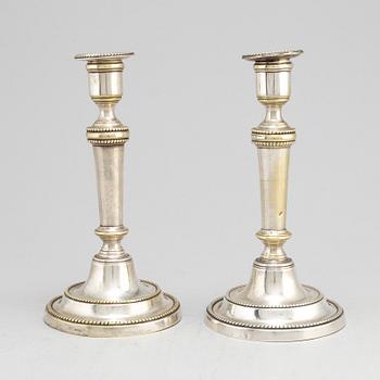 A pair of late 18th century/early 19th century plate candlesticks.