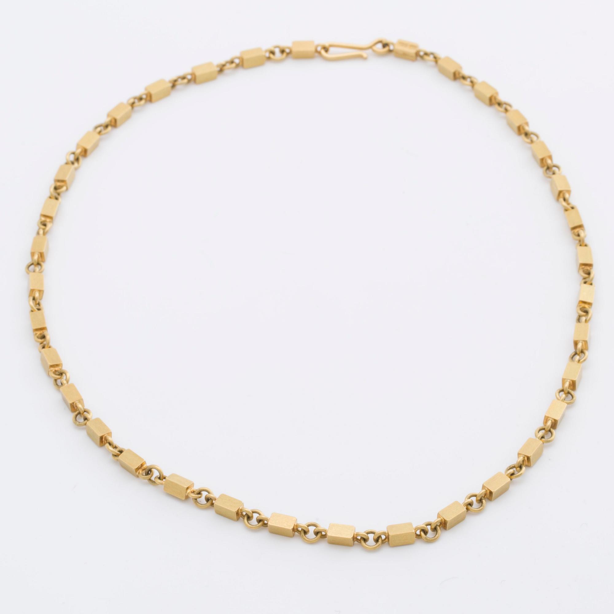 WIWEN NILSSON COLLIER 18K guld mindre stavar och ringar, Lund 1970, original etui.