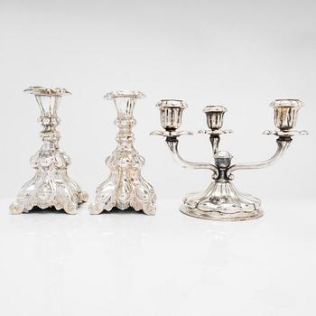 A mid-20th century silver candelabra and two candlesticks.