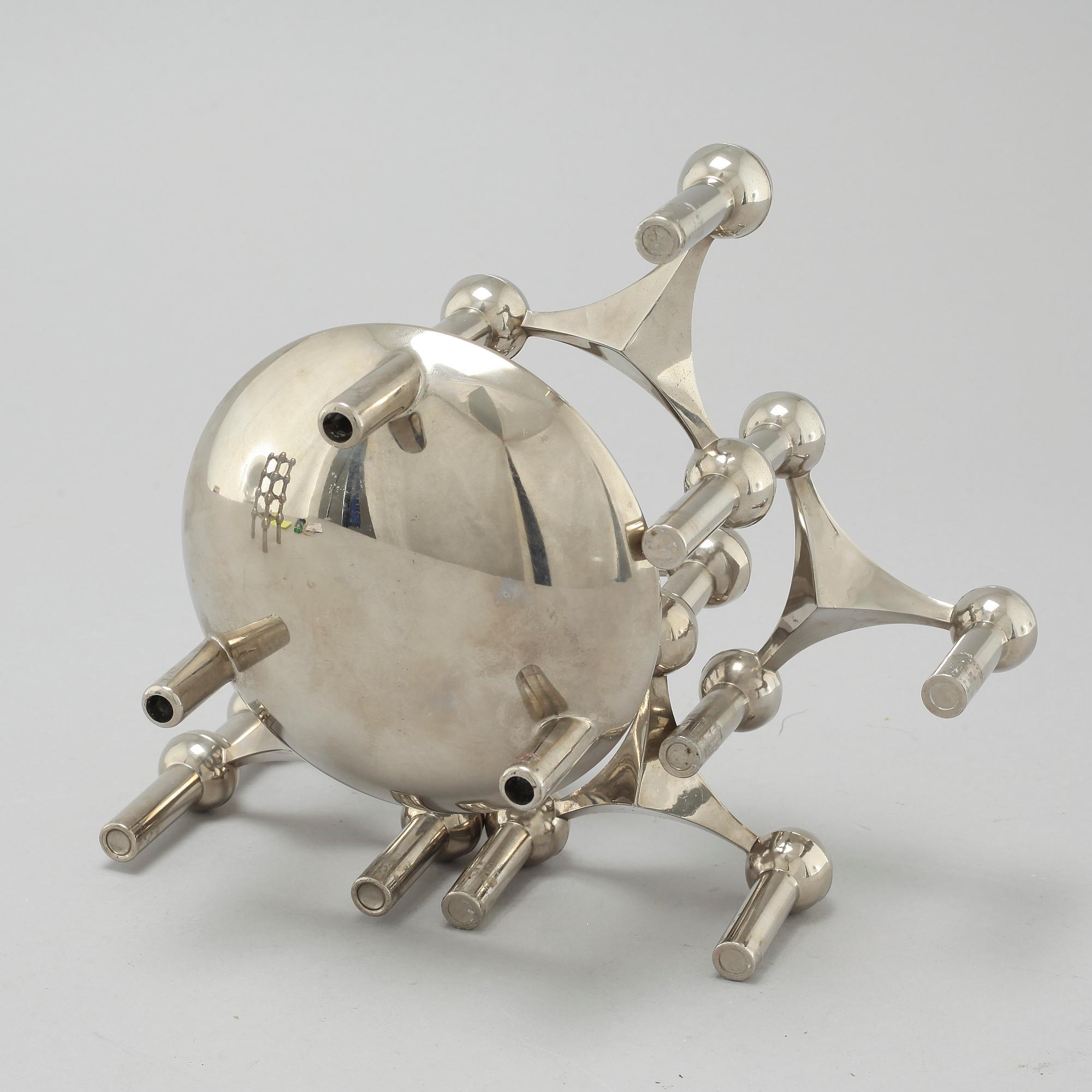 A metal candlestick with eleven parts by Ceasar Stoffi and Fritz Nagel, second half of the 20th century.