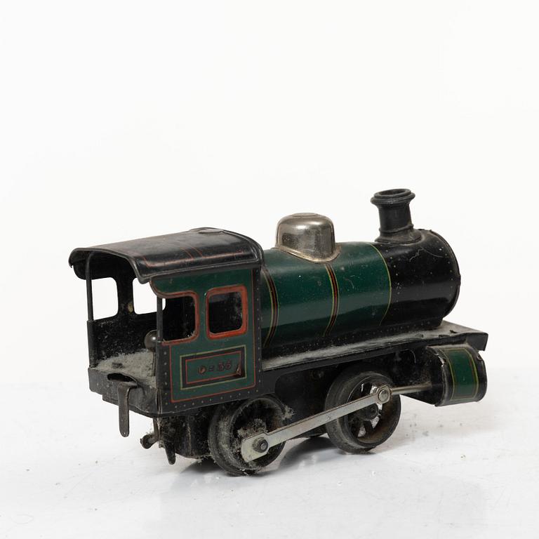 Model train with track and station building, 13 pieces, Germany, 1920s.