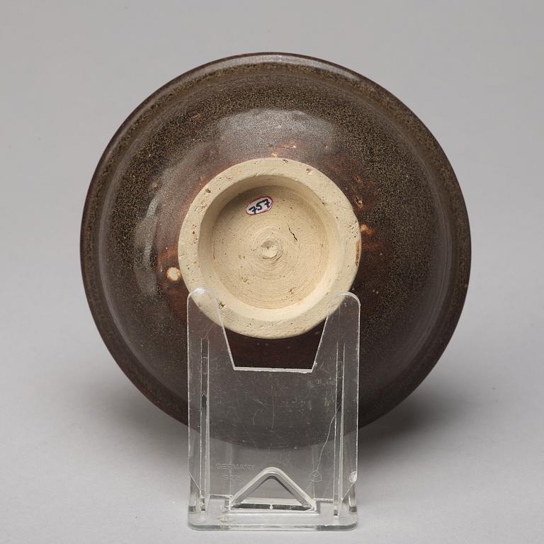 A group of three brown glazed bowls, China, 20th Century.