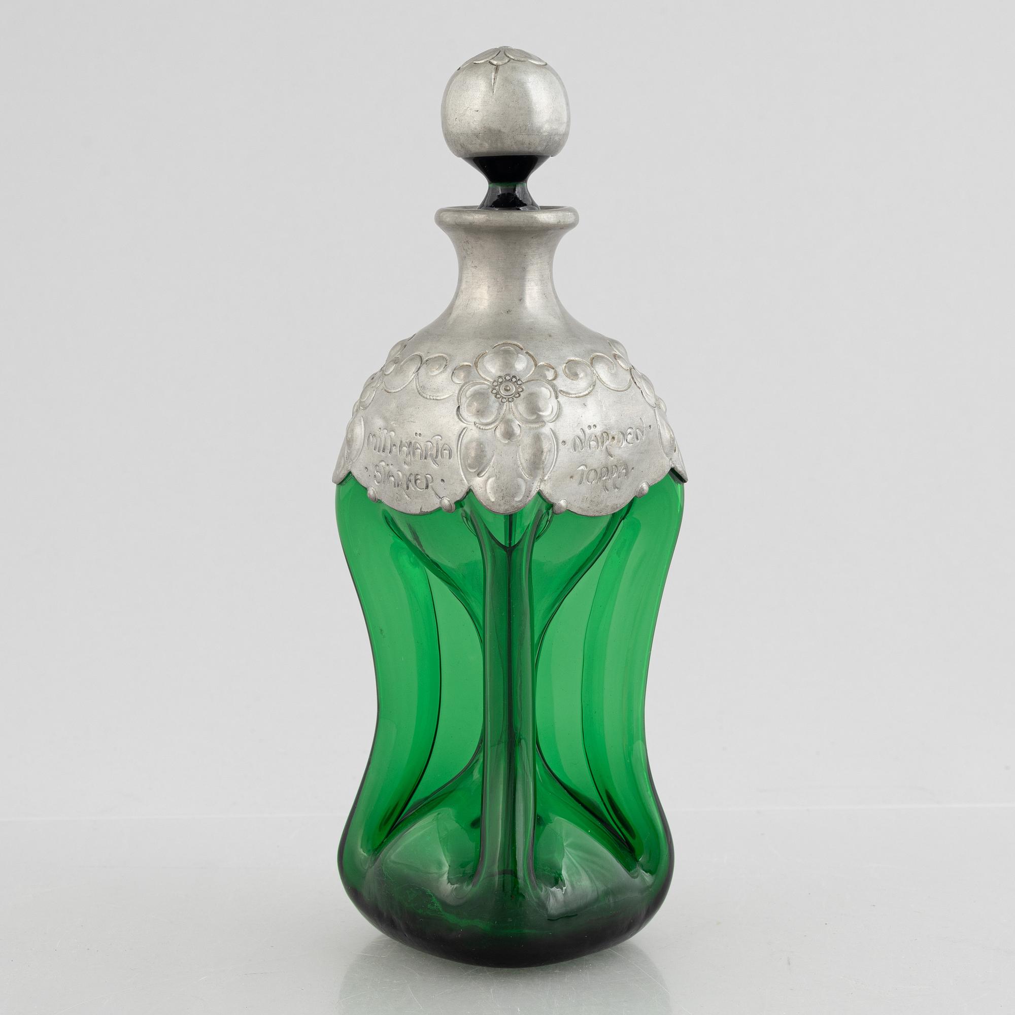 A green glass bottle with stopper, Sweden, early 20th century.