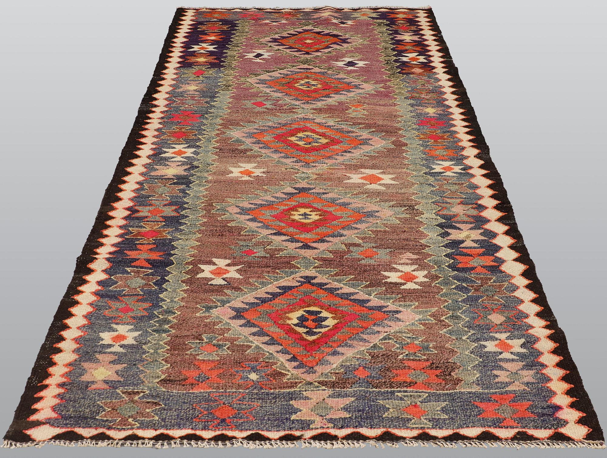 A Kelim rug, c. 253 x 120 cm.