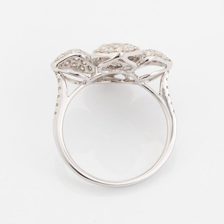 Brilliant cut diamond flower ring.