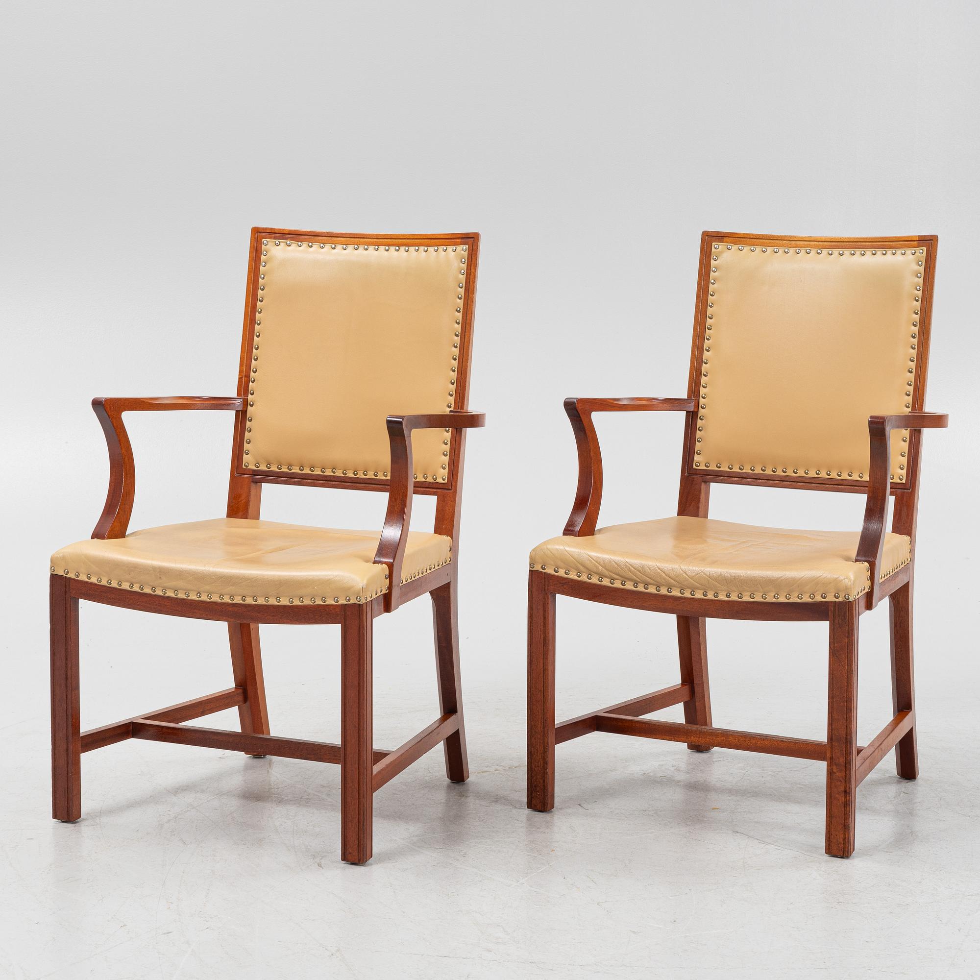 A par of stained beech wood armchairs, end of the 20th Century.