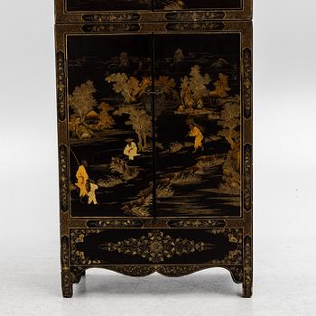 A Chinese lacquered two-part cabinet, first part of the 20th century.