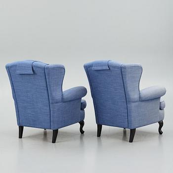 Fåtöljer ett par, med fotpallar, Bröderna Andersson.