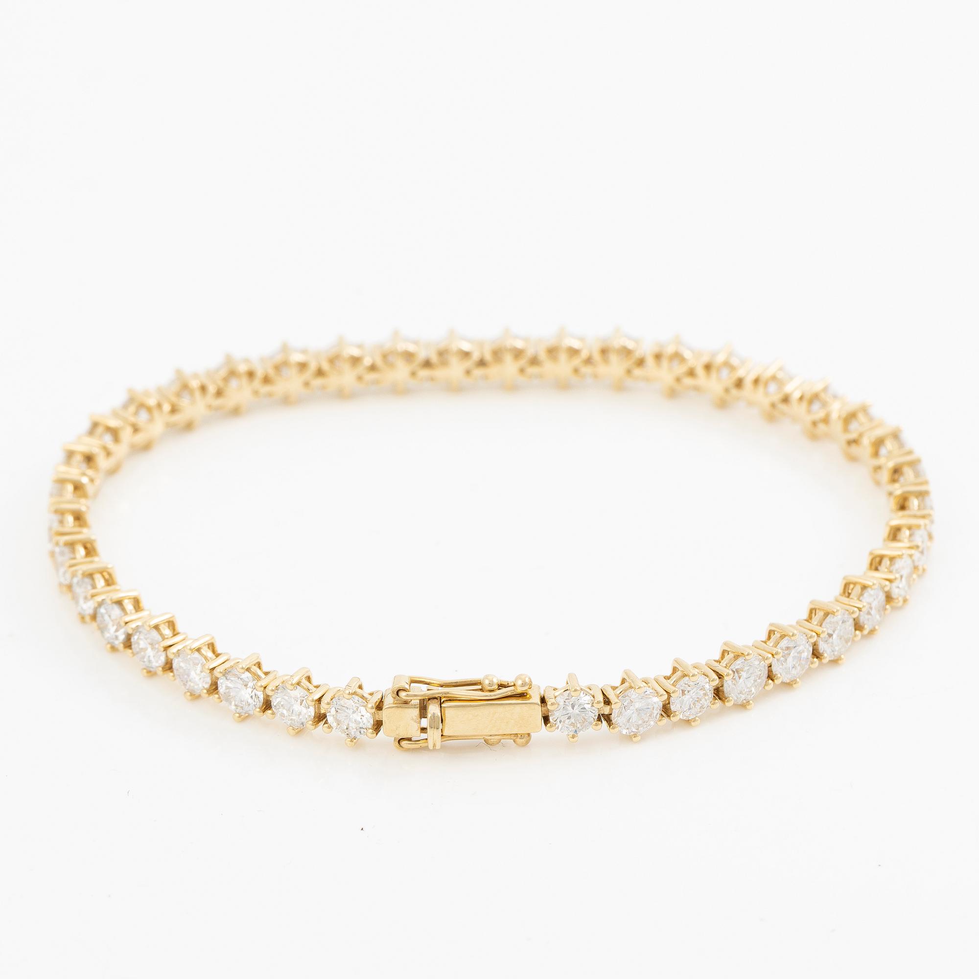 Tennis bracelet in 18K gold with brilliant-cut diamonds.