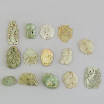 A set of 14 Chinese pendants/charms, some nephrite.