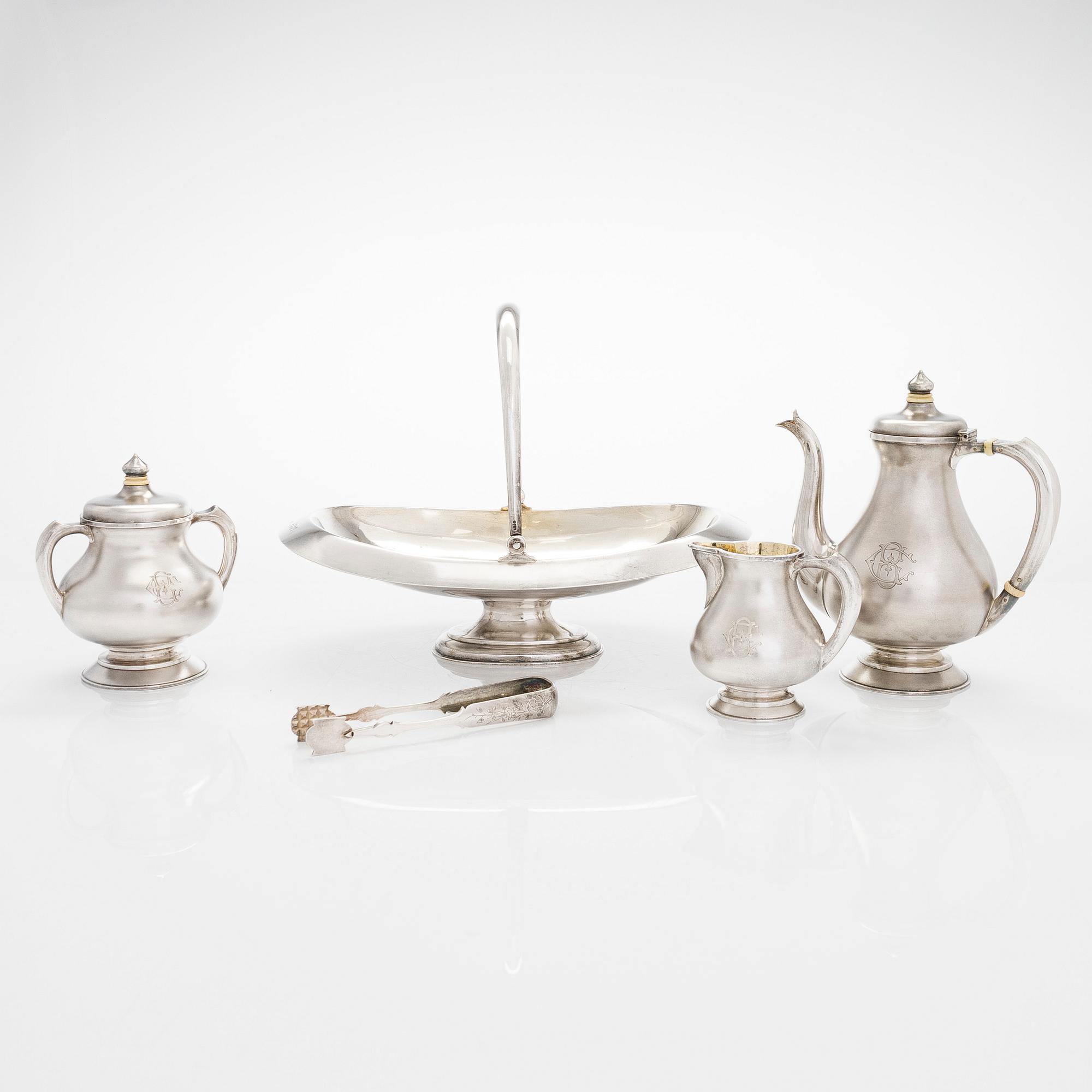 A four-piece silver coffee set, St. Petersburg 1887, original fitted box from Khlebnikov. Sugar tong, Moscow around 190.