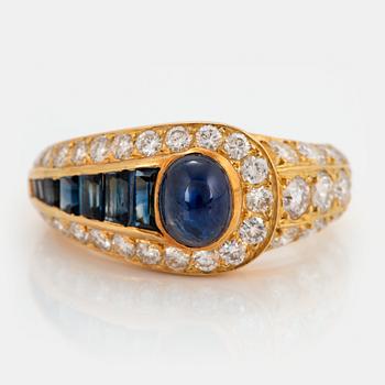 965. An 18K gold Wempe ring set with sapphires and round brilliant-cut diamonds.