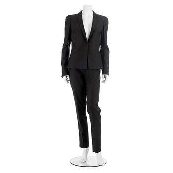 549. NOIR, a black wool and silk two-picee suit consisting of jacket and pants, size 42.