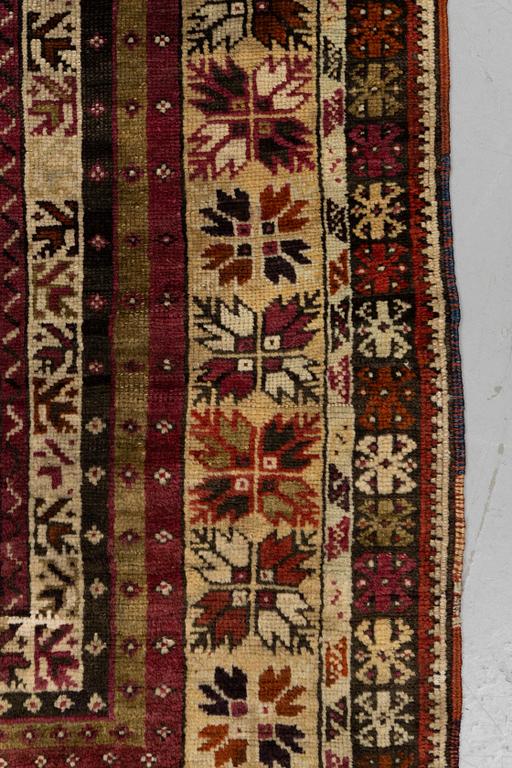 A carpet, antique Avanos, ca 190 x 136 cm (as well as 5 and 6 cm of flat weave on each end.).