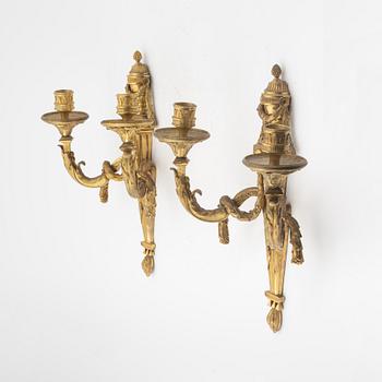 A pair of Louis XVI style two light wall-lights.