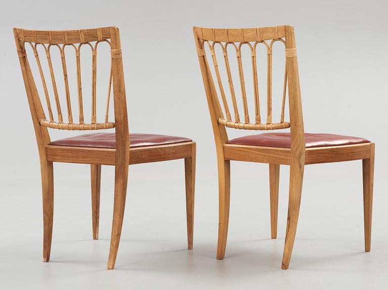 A pair of Josef Frank walnut and rattan chairs, Svenskt Tenn, model 1165.