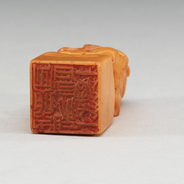 A yellow soapstone seal.