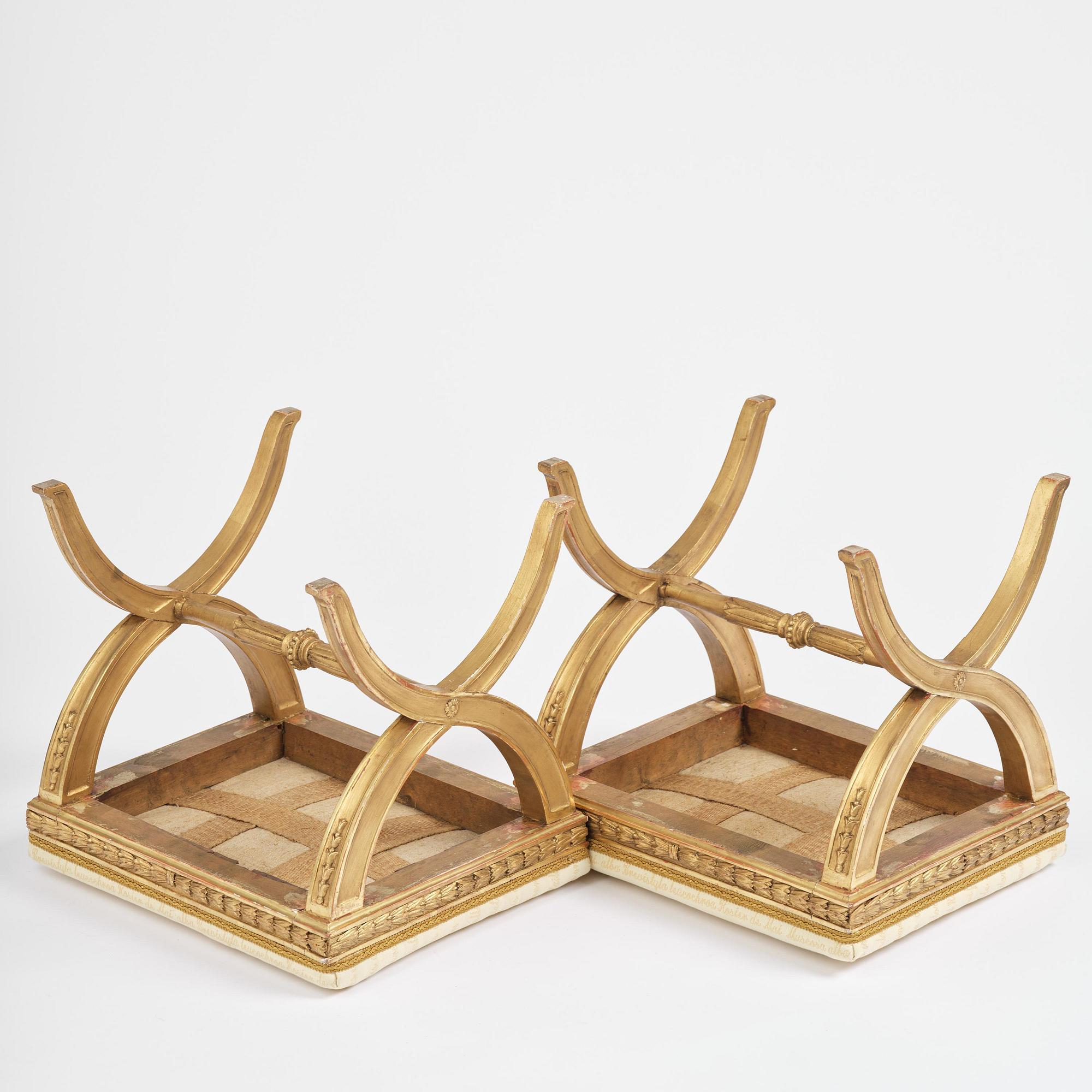 A pair of late Gustavian giltwood stools, Stockholm, late 18th century.