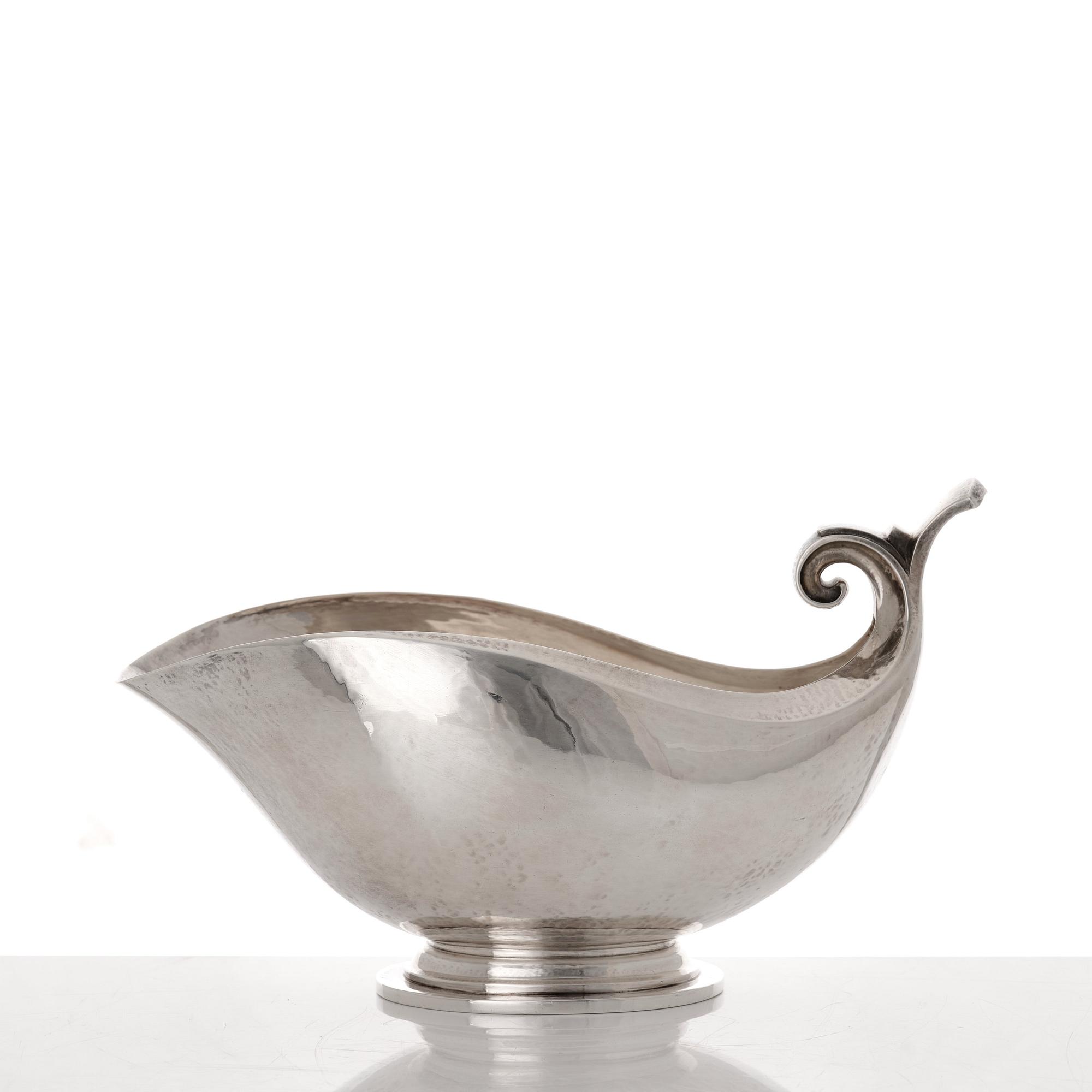 Georg Jensen, a sterling silver sauceboat and ladle, Copenhagen 1925-1945, design nr 98 and 141.