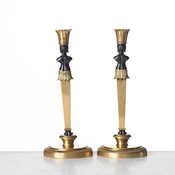 A pair of Empire style candlesticks. Late 19th century.