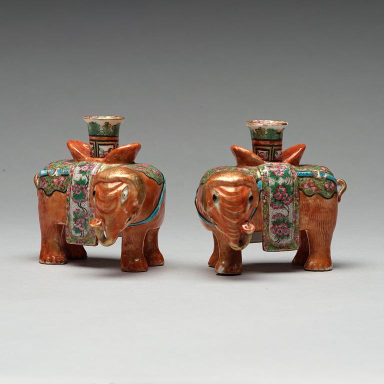 A pair of Canton candle sticks in the shape of elephants, Qing dynasty, 19th century.