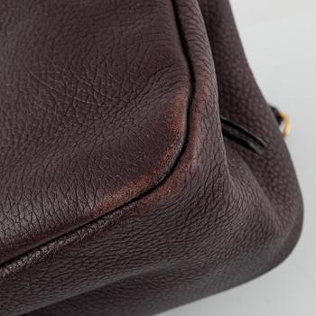Mulberry, a burgundy leather handbag.