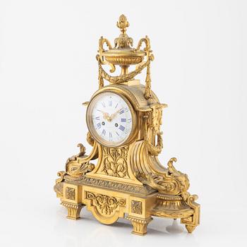 A Louis XVI-style gilt bronze mantel clock, 19th Century.