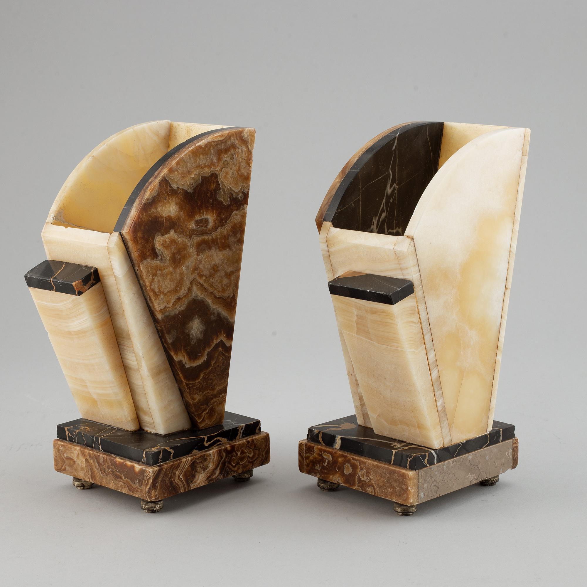 A three piece clock garniture, Art Deco style, 20th Century.