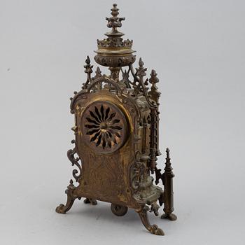 A mantle clock with pair of candelabra, late 19th century.