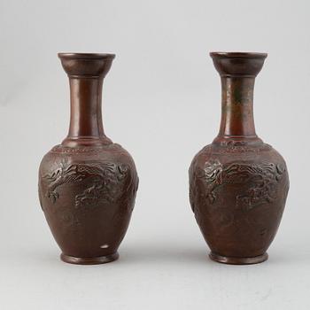 A pair of Japanese copper alloy temple vases, Meiji period (1868-1912).