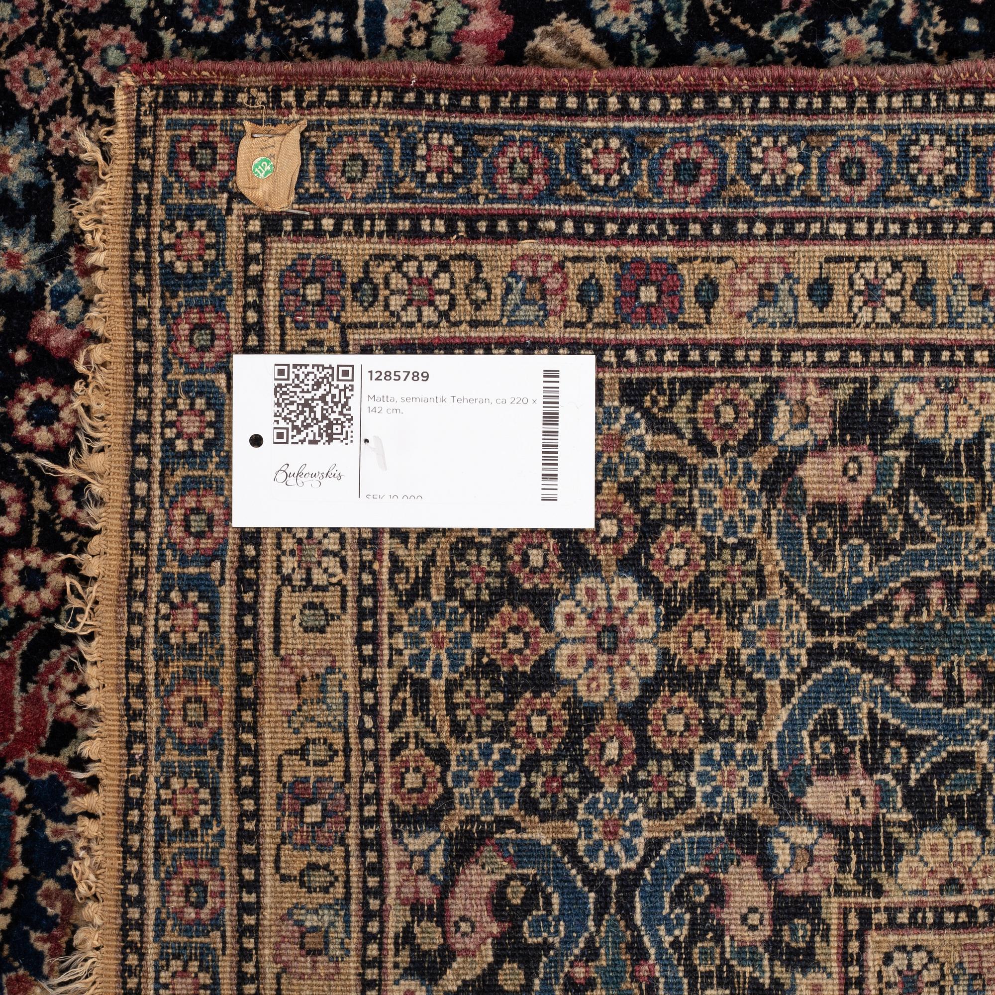 A carpet, a semi-antique Tehran, possibly, ca 220 x 142 cm.