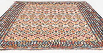 A kilim carpet, circa 396 x 310 cm.