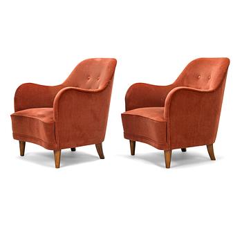 A pair of mid-20th-century armchairs.