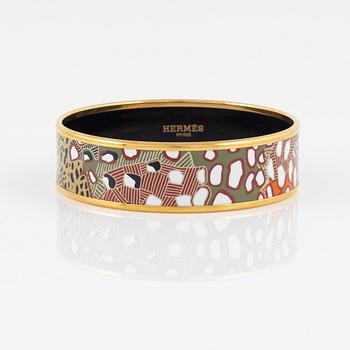 Hermès, an enamel and gold plated metal bangle.