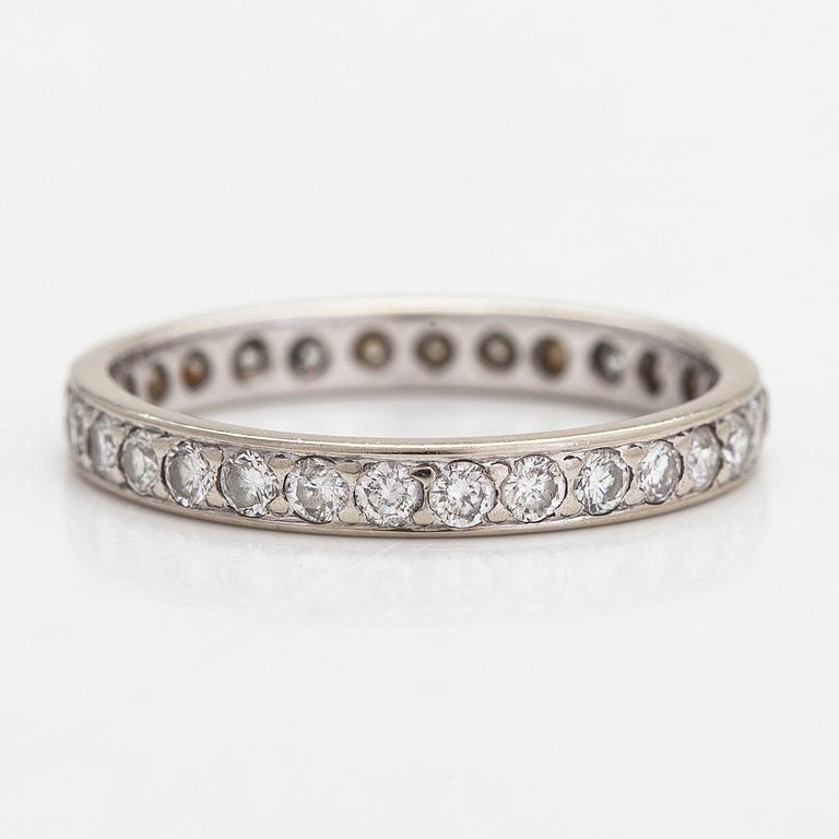 An 18K white gold eternity ring with brilliant-cut diamonds totalling approximately 0.60 ct.
